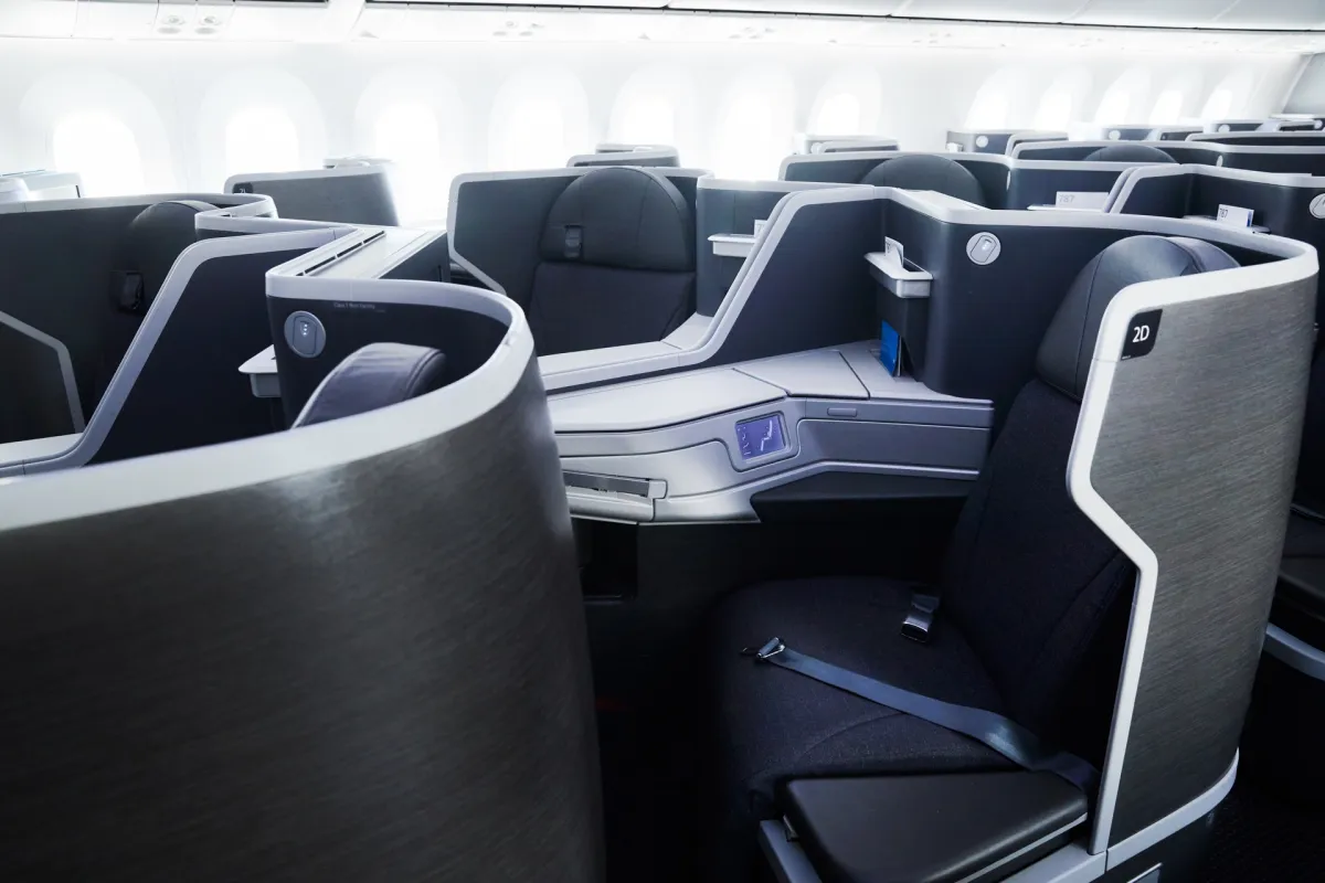 American Airlines Flagship Business fully-flat seat in an empty wide-body cabin, representing the premium-cabin payoff of Platinum Pro status