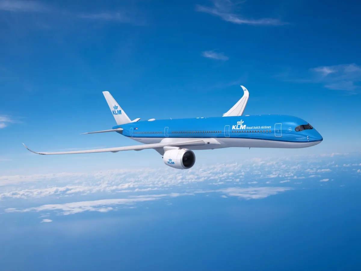 An Air France-KLM Airbus A350-900 in flight against a clear sky, representing the paid flying that earns Flying Blue XP
